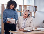 Black woman, manager and talking call center training with report notes on sales for telemarketing. Supervisor or coach with man at computer desk for customer support, crm or telecom faq information