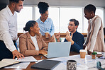 Business people, laptop and meeting in collaboration for planning, idea or marketing strategy at office. Group of creative employees by computer discussing project, teamwork or brainstorming startup