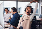 Tired black woman, yawning and stretching in call center for break in customer services or desktop support at office. African American female exhausted consultant in arm stretch from telemarketing
