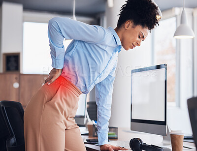 Buy stock photo Back pain, office and business black woman with injury, muscle ache and spine problem standing at desk. Medical emergency, stress and tired female worker massage body for strain, tension and accident