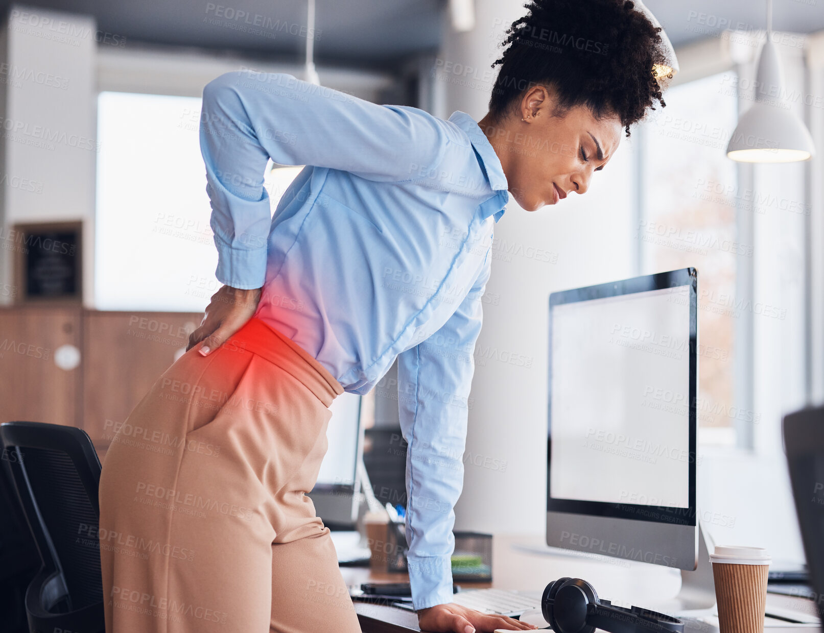 Buy stock photo Back pain, office and business black woman with injury, muscle ache and spine problem standing at desk. Medical emergency, stress and tired female worker massage body for strain, tension and accident