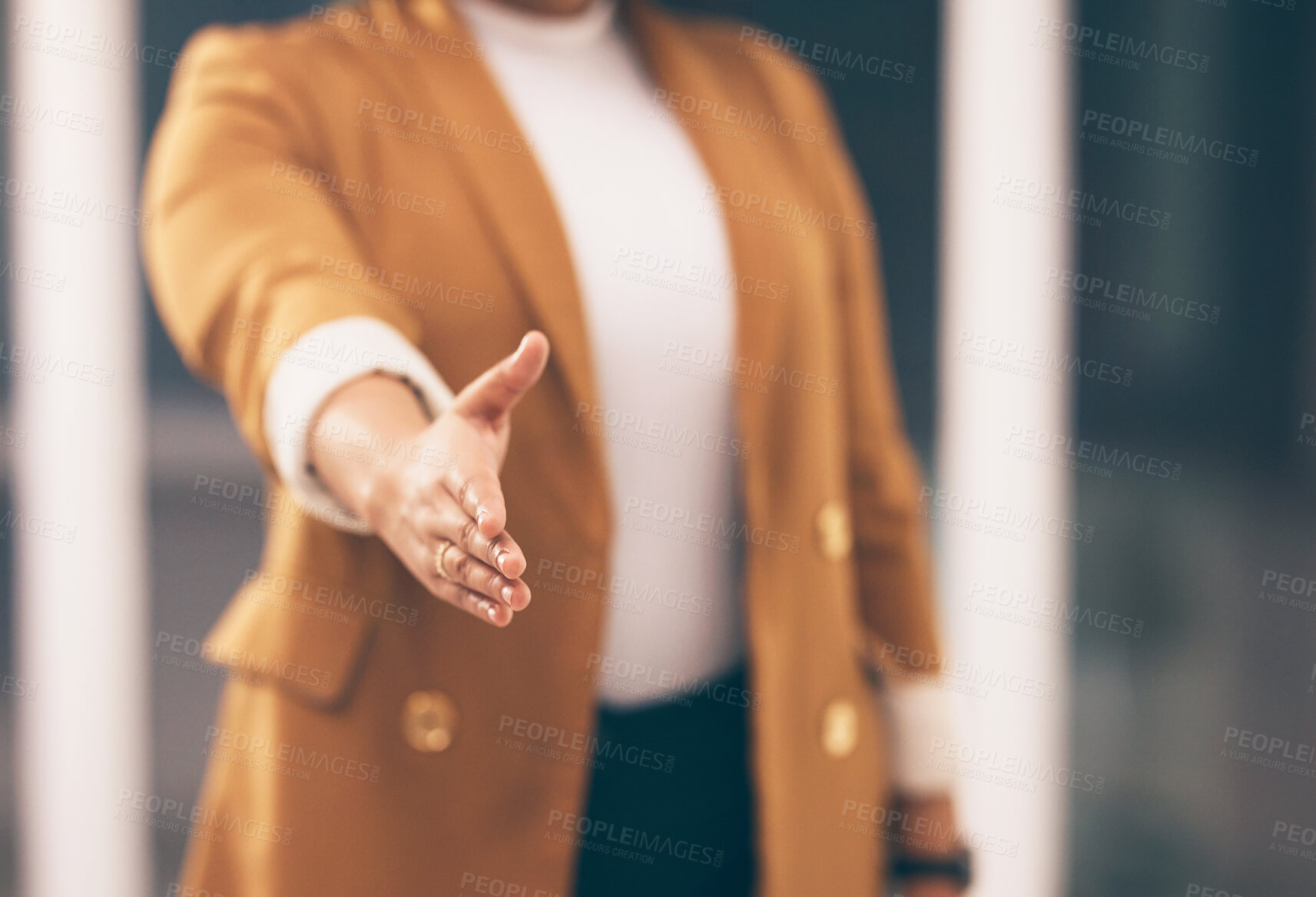 Buy stock photo Professional woman with a handshake gesture for greeting, welcome or partnership in office. Company, corporate and female employee stretching hand for shaking hands for agreement in modern workplace.