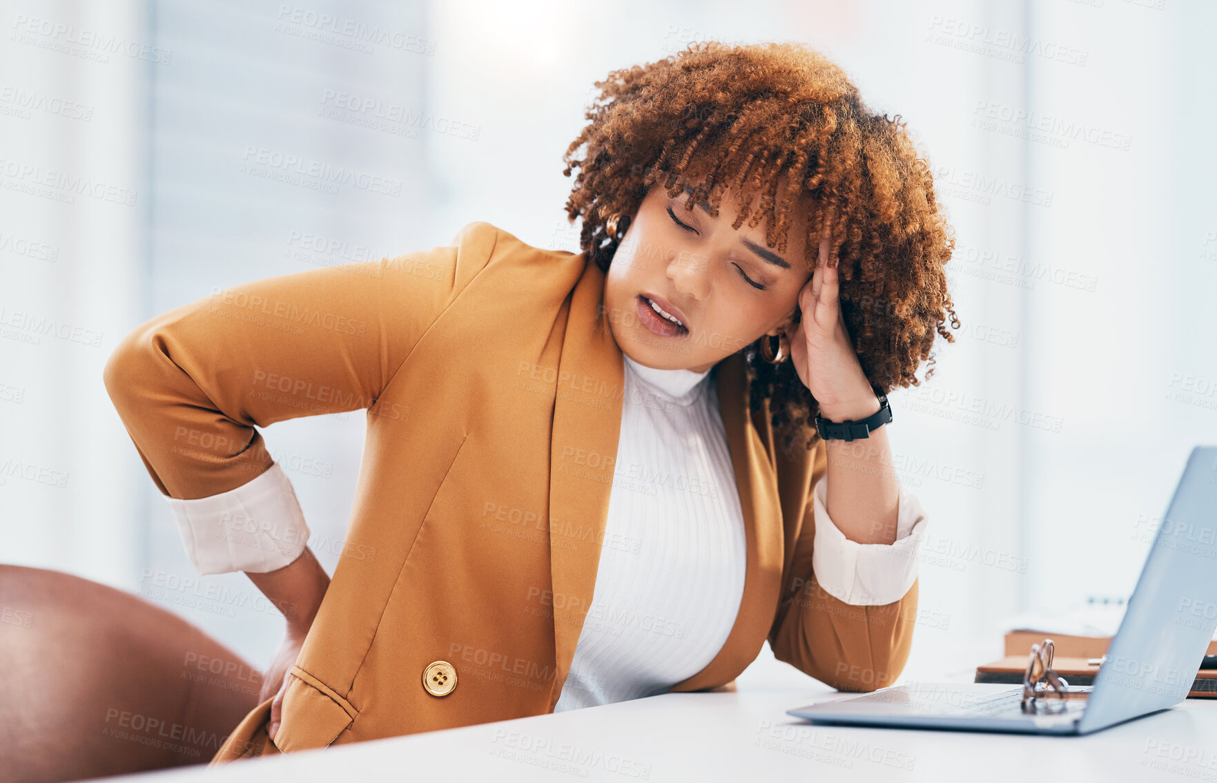 Buy stock photo Black woman with back pain, corporate burnout and stress with headache, stiff muscle from spine injury and overworked. Female worker at desk, business and medical emergency with health and strain