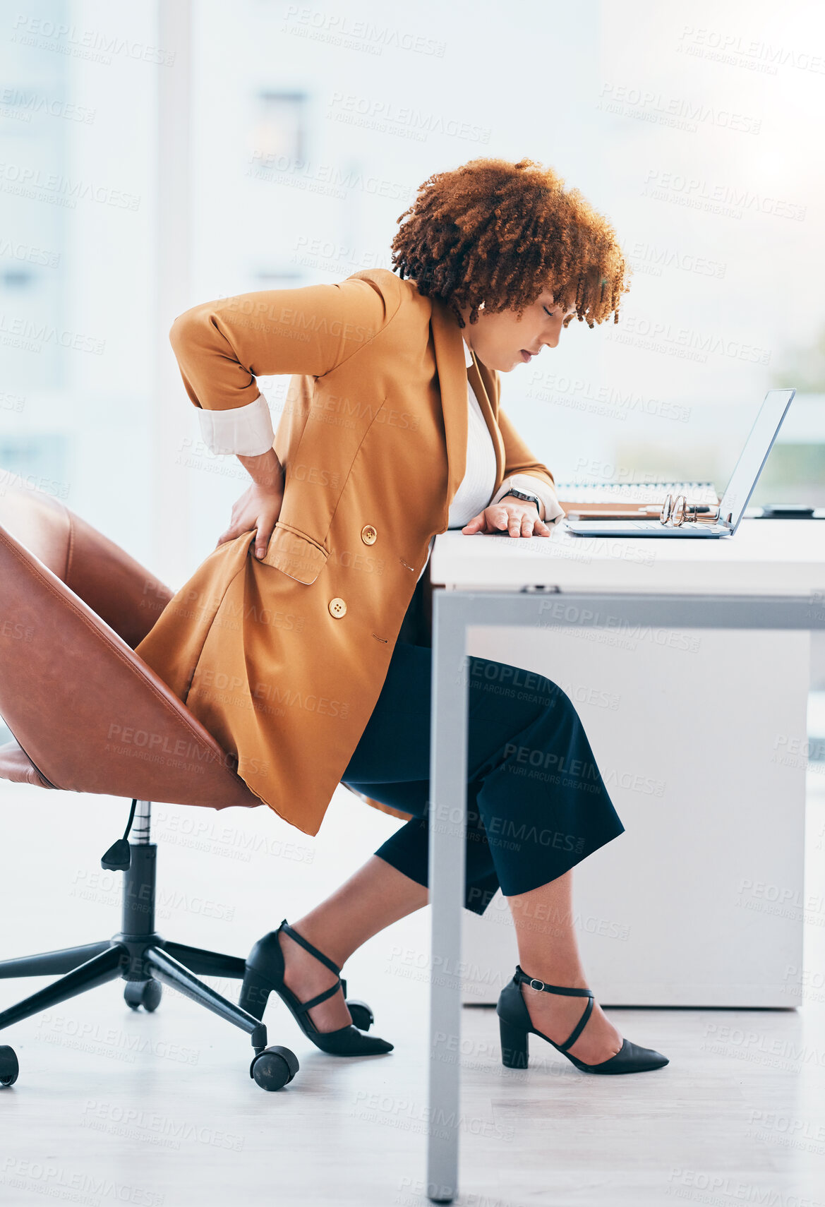 Buy stock photo Black woman in business with back pain, burnout and stress, stiff muscle from spine injury and overworked. Female worker at desk, corporate and medical emergency with health problem and strain