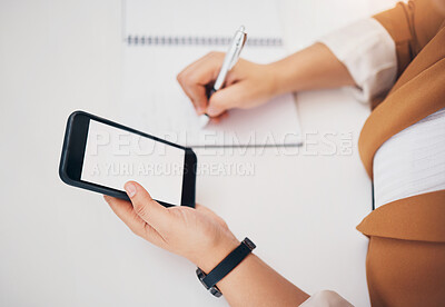 Buy stock photo Woman, hands and phone writing on mockup above for schedule planning, diary or notebook on table. Hand of female with smartphone screen display and book to write notes for project plan or strategy