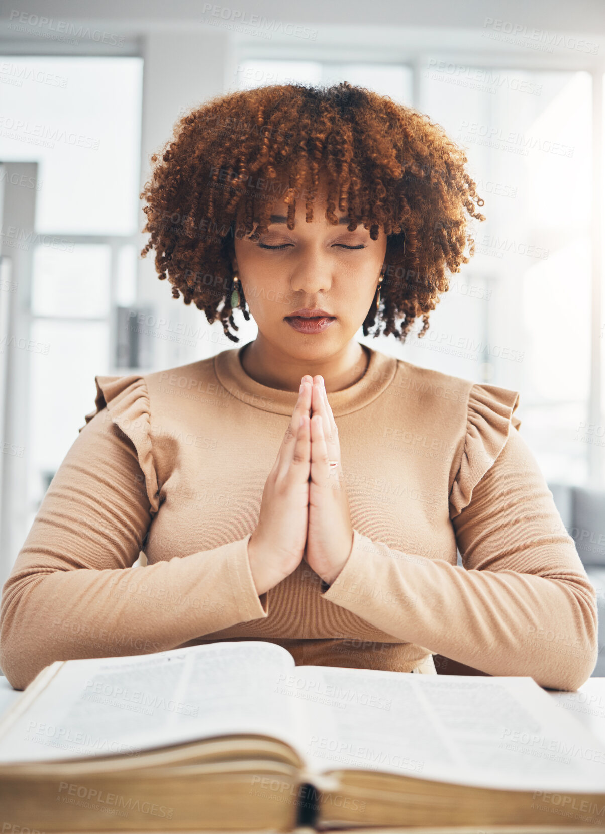 Buy stock photo Praying, black woman and holy book for religion, faith and god help, support and spiritual healing at home. Prayer hands, hope and christian person with bible education for hope, trust and worship