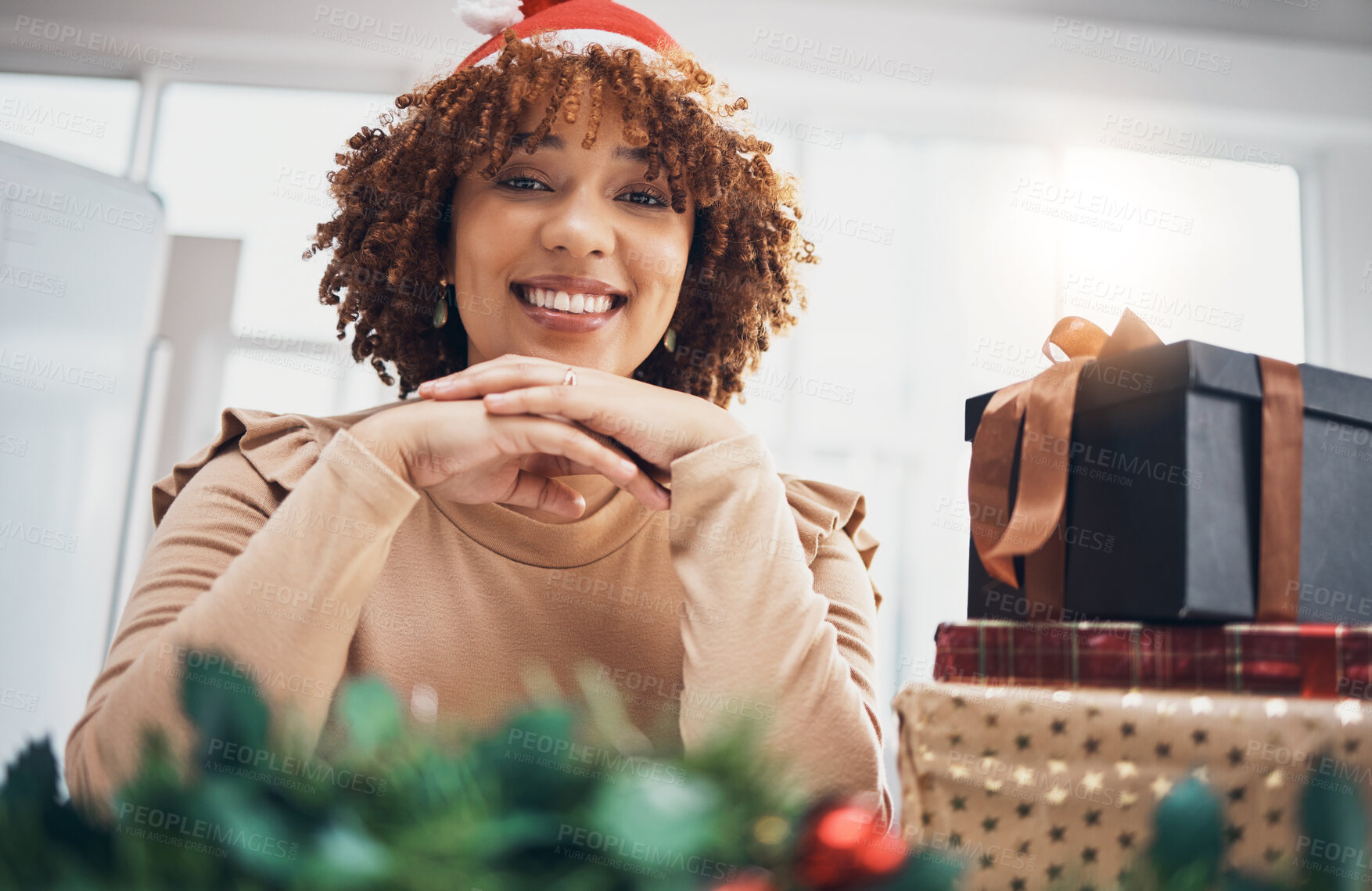 Buy stock photo Christmas, gift or portrait and a business black woman posing with a box at an office party or event. December, holiday or present with a female employee sitting next to a giftbox while feeling happy