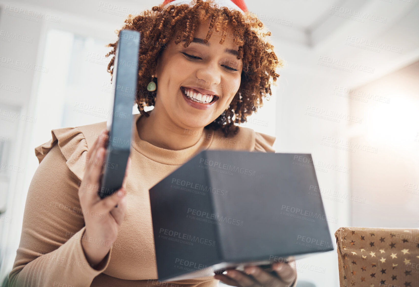 Buy stock photo Christmas, gift and celebration with a business black woman opening a box at an office party or event. December, holiday and present with a female employee holding a giftbox while feeling happy