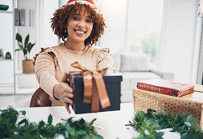 Buy stock photo Christmas, gift and portrait with a happy black woman giving a box at an office party or event. December, holiday and present with a female employee in business holding a giftbox for celebration