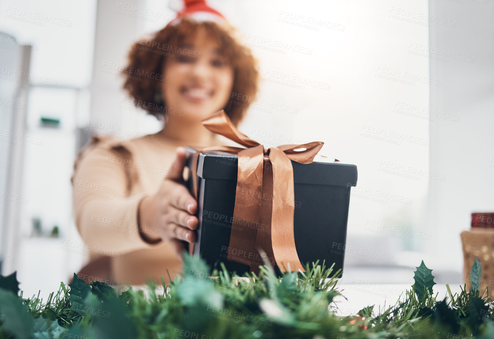 Buy stock photo Christmas, gift and celebration with a business black woman giving a box at an office party or event. December, holiday and present with a female employee holding a giftbox while feeling happy