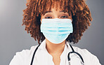 Portrait, healthcare and black woman with mask, wellness and protection against grey studio background. Face cover, African American female doctor and medical professional with safety regulations