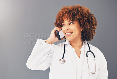 Buy stock photo Consulting, thinking and doctor on a phone call for healthcare isolated on a grey studio background. Contact, happy and black woman speaking on a mobile for medicine, consultation and medicare