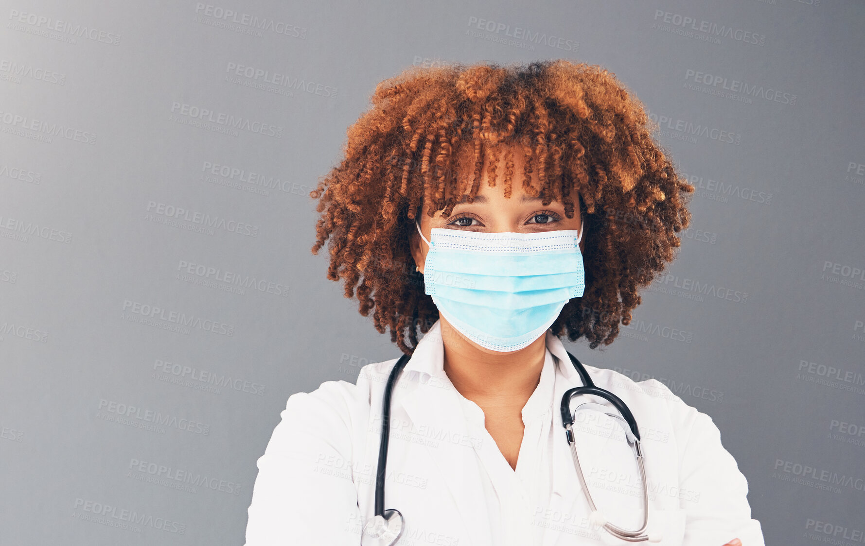 Buy stock photo Portrait, mockup and healthcare with black woman, mask and safety regulations against grey studio background.   Face cover, Jamaican female doctor and medical professional with stethoscope and trust