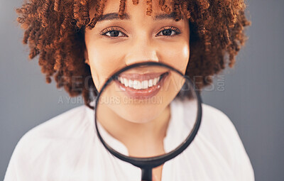 Buy stock photo Beauty, magnifying glass and portrait with a black woman in studio to examine or check a skin routine. Wellness, investigation or skincare with an attractive young female searching her face for acne