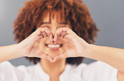 Buy stock photo Heart, love and sign with hands of black woman for peace, support and emoji gesture. Confident, happy and smile with girl and self love shape for wellness, happiness or creative in studio background 