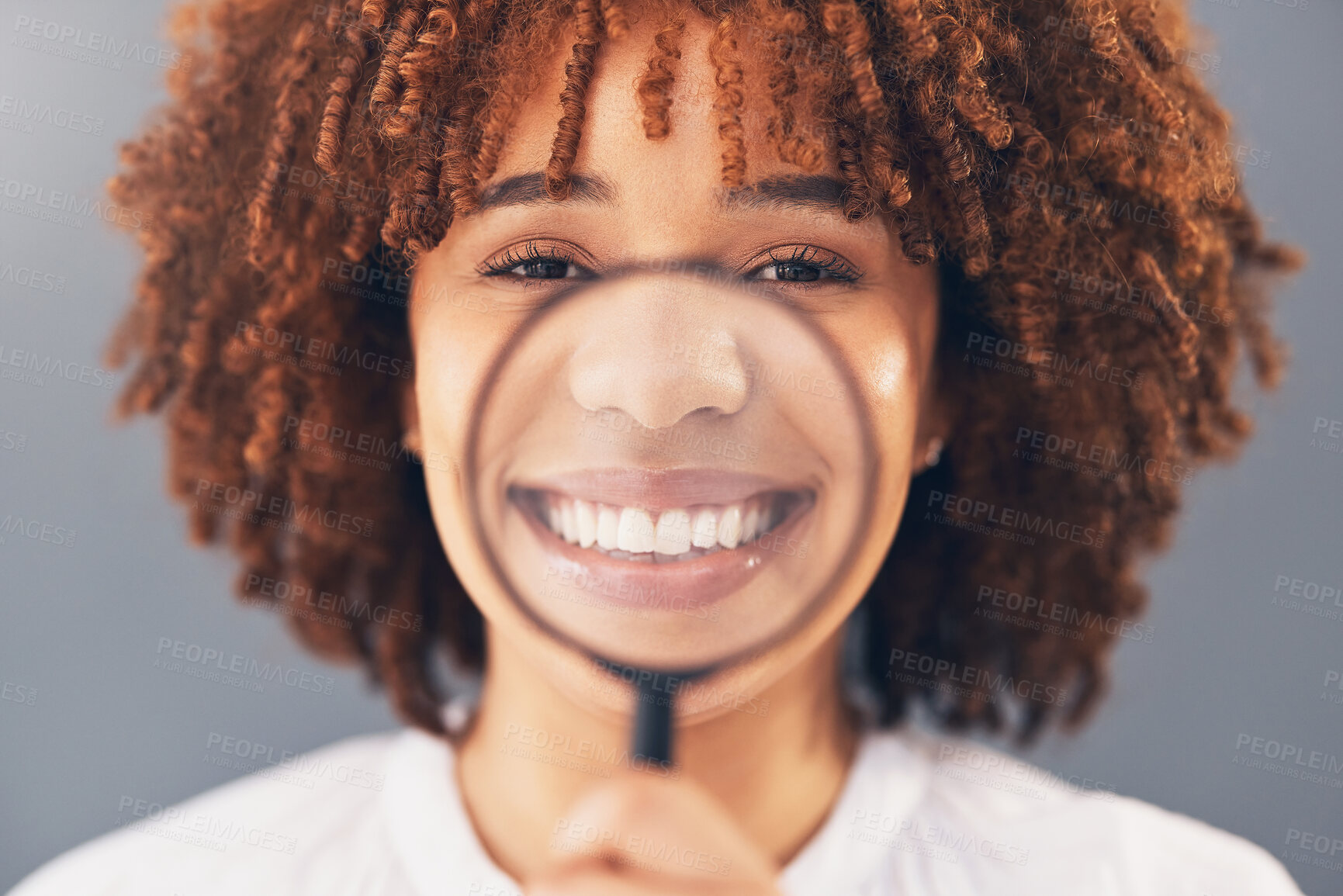 Buy stock photo Happy, portrait and black woman with magnifying glass in a studio for a investigation or research. Happiness, smile and portrait of a young African female model with a zoom lens by a gray background.