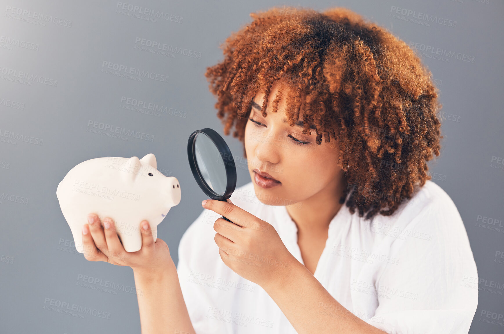 Buy stock photo Magnifying glass, piggy bank or black woman with savings budget or financial profits growth on studio background. Curious, cash loan debt or broke girl searching for finances or money investment 