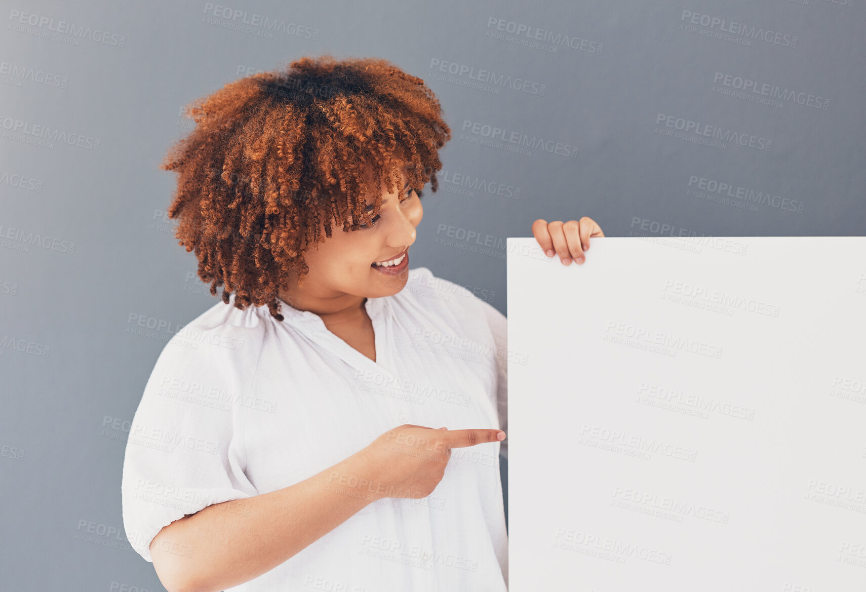 Buy stock photo Black woman, board and banner with mockup and marketing, product placement and brand on studio background. Poster, white space and female pointing with smile, advertising and branding and promotion