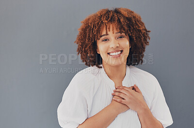 Buy stock photo Black woman, portrait and face with hands on chest or heart for love, care and support for charity. Face of African person with hand for gratitude, kindness and trust or thank you on gray background