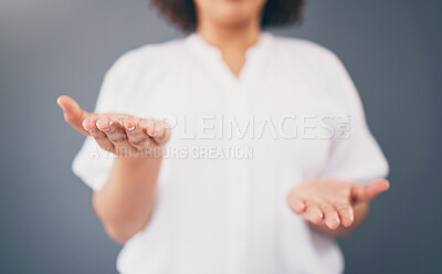Buy stock photo Woman, hands and space for choice in studio for product placement, palm and mockup or decision. Model person with hand for advertising promotion deal and brand offer or balance scale gray background