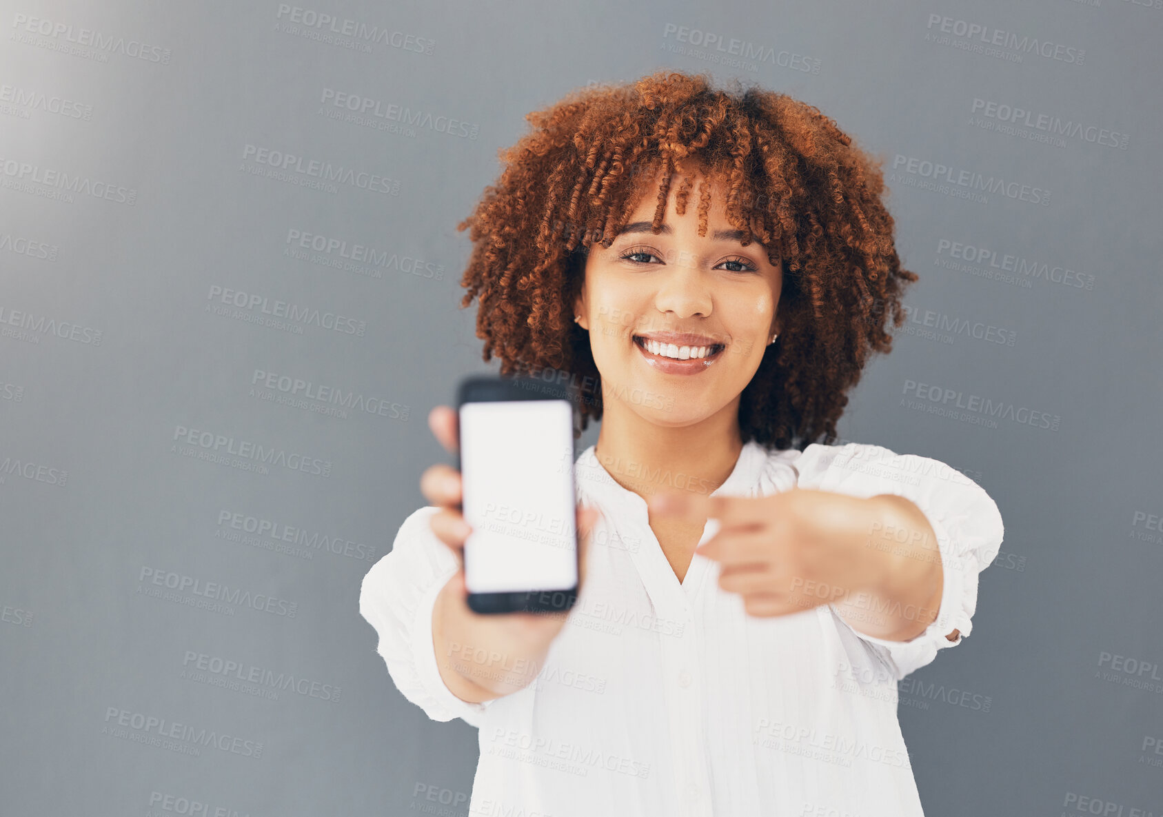 Buy stock photo Mockup, blank phone screen and black woman hand pointing to digital advertisement and web message. Discount, sale and promotion deal mock up of a young female in a studio with gray background
