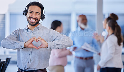 Buy stock photo Call center, heart hands and portrait of customer service agent with headset, mockup and smile on face in office. Smiling business man, help desk consultant with care and confidence at crm agency job