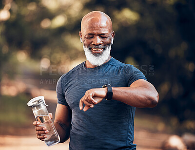 Buy stock photo Black man, music and fitness watch with water bottle and smile outdoor for cardio time. Senior person happy in nature forest with smartwatch for exercise, workout and training for health and wellness
