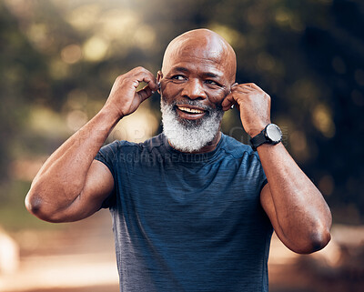 Buy stock photo Black man, listening to music and smile for fitness and exercise outdoor in nature for cardio. Happy senior person with earphones for podcast during training or workout for body health and wellness