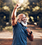 Park, success and running, winning black man excited and celebration at fitness run in nature with earphones. Music, workout and mature runner with smile and happy to celebrate exercise achievement.