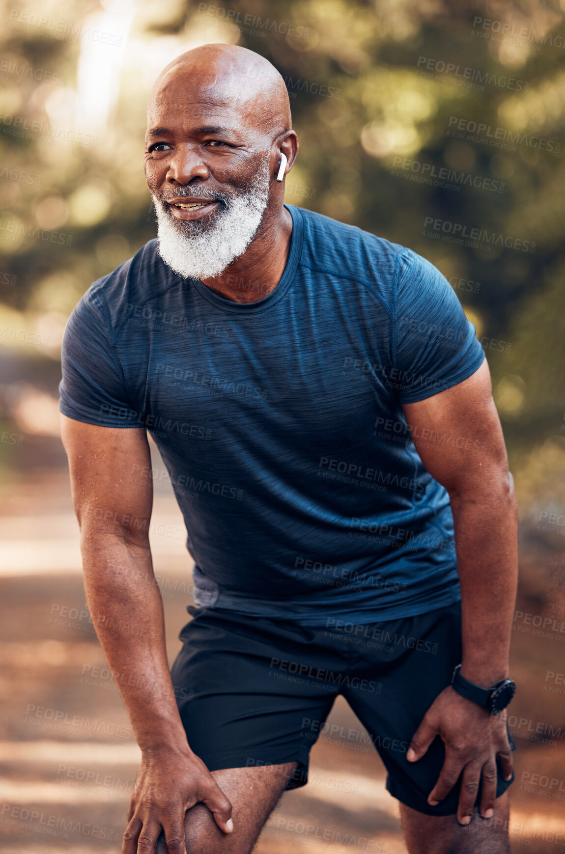 Buy stock photo Black man, running break and breathing for fitness, exercise and workout in nature, park or garden. Senior male, sports rest and smile for motivation, health and outdoor wellness training with music