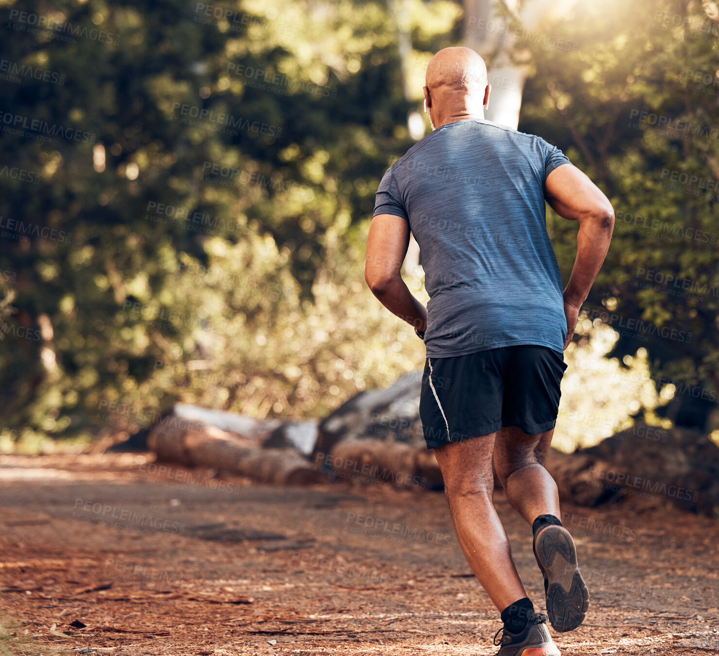 Buy stock photo Back of black man running in park, nature and forest for cardio workout, exercise or training. Sports male, runner and outdoor fitness from behind for energy, healthy lifestyle and wellness in garden