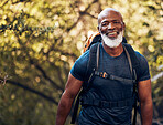 Happy, hiking and portrait of black man in forest for freedom, health and sports training. Exercise, peace and wellness with senior hiker trekking in nature for travel, summer break and adventure