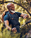 Hiking, man and watch on adventure in nature forest for trekking, fitness and cardio exercise. Senior black person with backpack while walking outdoor in woods for travel, health and wellness
