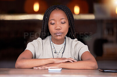 Buy stock photo Depression, sad and woman with phone in coffee shop during breakup or fight on her cellphone. Depressed, moody and unhappy African female with mental health problem with mobile after argument in cafe