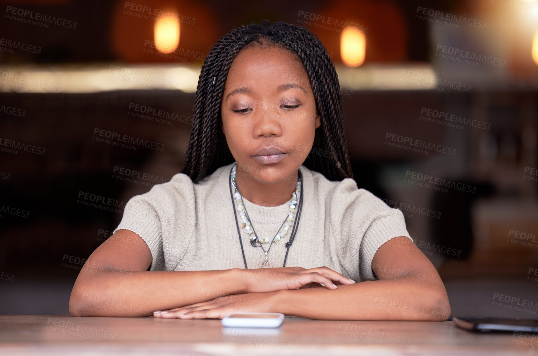 Buy stock photo Depression, sad and woman with phone in coffee shop during breakup or fight on her cellphone. Depressed, moody and unhappy African female with mental health problem with mobile after argument in cafe