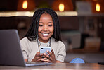 Black woman, phone and smile for social media, communication or chatting and texting at cafe. Happy African American female browsing, typing or reading chat in networking on mobile smartphone app