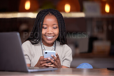 Buy stock photo Black woman, phone and laptop with smile for social media, communication or chatting and texting at cafe. Happy African American female freelance browsing, typing or working remote on smartphone app