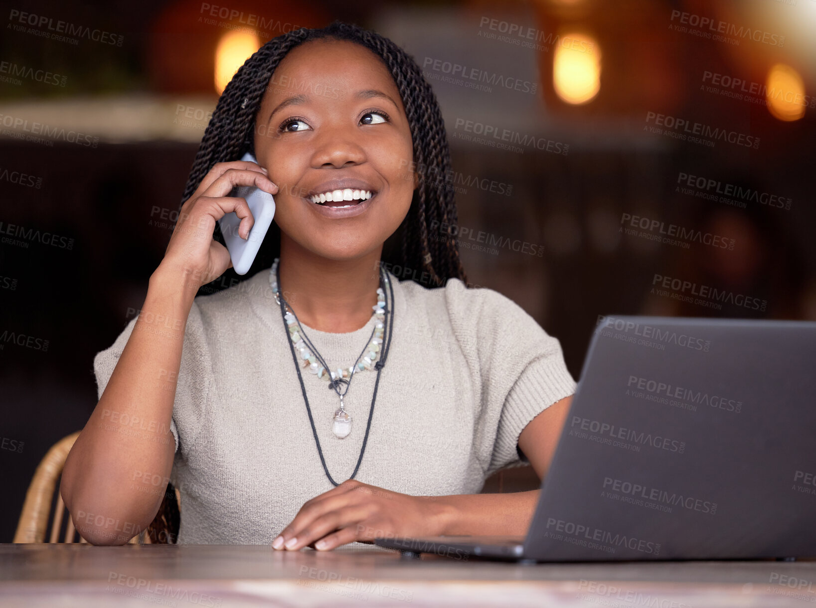 Buy stock photo Black woman, phone call and laptop with smile at cafe for communication, conversation or discussion. Happy African American female freelancer smiling and talking on mobile smartphone by computer