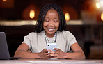 Black woman, phone and smile for social media, communication or chatting and texting at cafe. Happy African American female freelancer smiling for wifi on mobile app, browsing or chat on smartphone