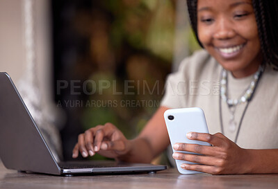 Buy stock photo Black woman, phone and laptop in remote work for communication, social media or chatting at cafe. Hands of happy African American female freelancer with smile working on computer and smartphone