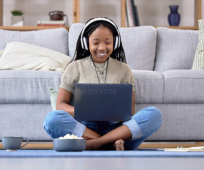 Buy stock photo Black woman, student and laptop with smile for elearning, education or entertainment by living room sofa at home. Happy African American female learner smiling on computer sitting by couch on floor