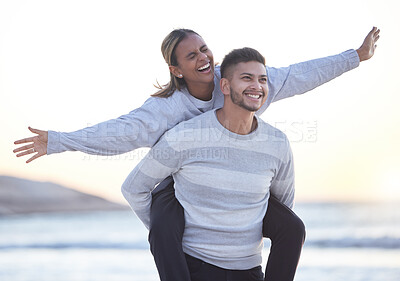 Buy stock photo Couple, piggyback and laughing at beach for love, care and happy outdoor date together. Man carrying fun woman at sea, freedom and support of trust, relax and vacation for happiness, travel and smile