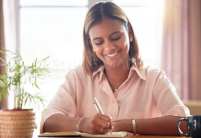 Buy stock photo University, planning and woman student writing in a notebook working on a school project in her home. Education, happy and female college scholar from Mexico studying for a test or exam in apartment.
