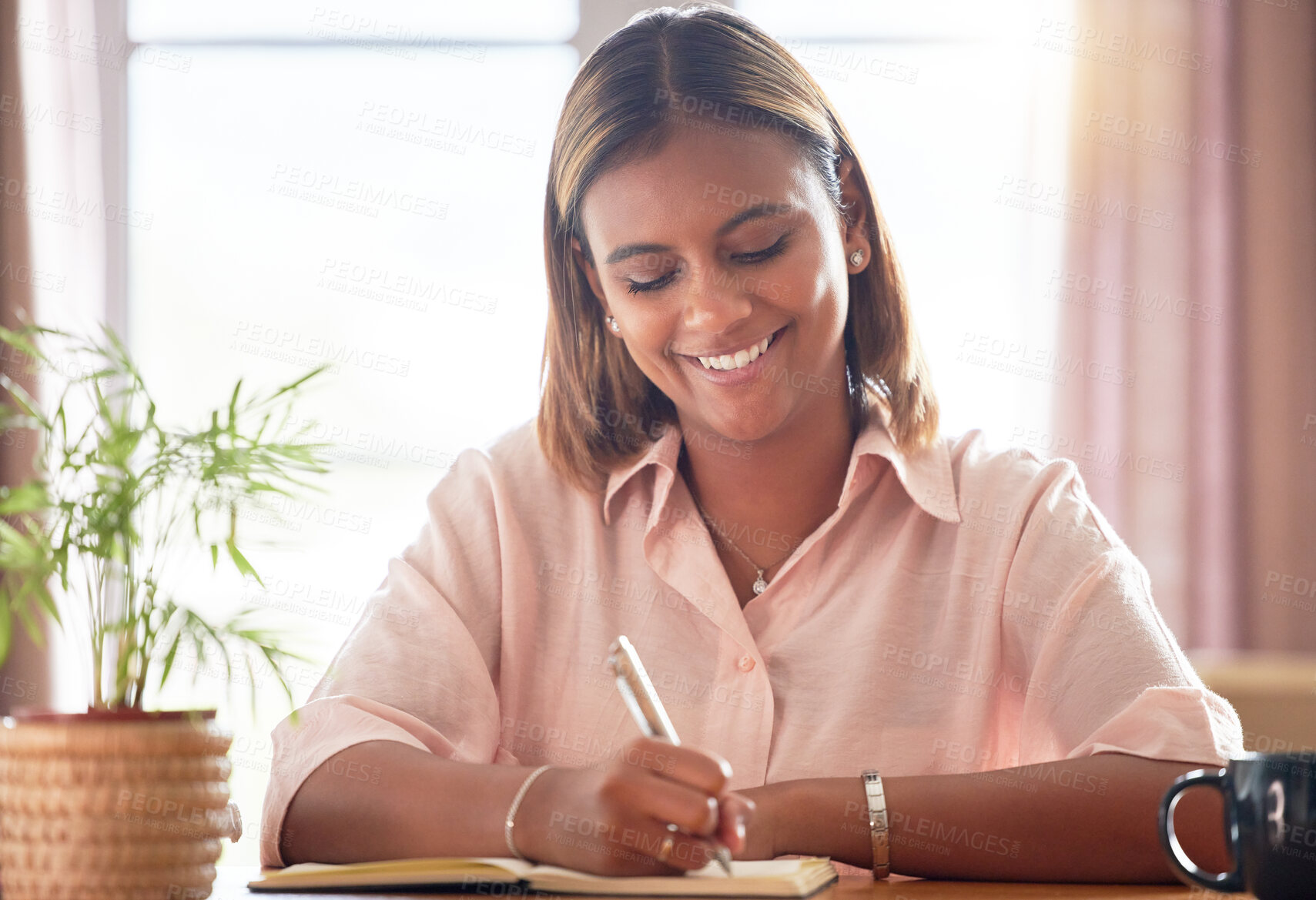 Buy stock photo University, planning and woman student writing in a notebook working on a school project in her home. Education, happy and female college scholar from Mexico studying for a test or exam in apartment.