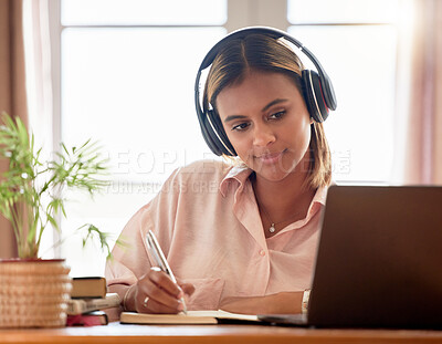 Buy stock photo Woman, student with laptop and headphones, writing notes in notebook, education and elearning with study notes. Mexican female, internet with wifi and tech, online class with webinar and studying