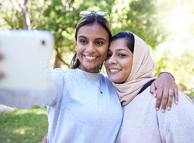 Buy stock photo Girl, friends and islam for selfie in park with smile, hug and happy for summer, adventure or outdoor bonding. Women, muslim and profile picture for social media app, happiness and together in nature