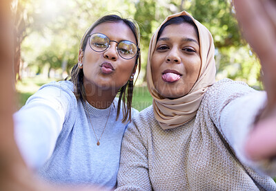 Buy stock photo Woman, muslim and friends selfie with funny face in park, nature and happiness for bonding on social media app. Happy women, profile picture and comic portrait in woods, outdoor and support together