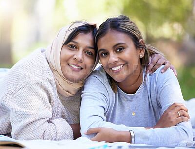 Buy stock photo Muslim women, portrait or hug in park, garden or school campus for relax bonding, friends picnic or community support. Smile, happy or Islamic students in embrace, fashion hijab or university college
