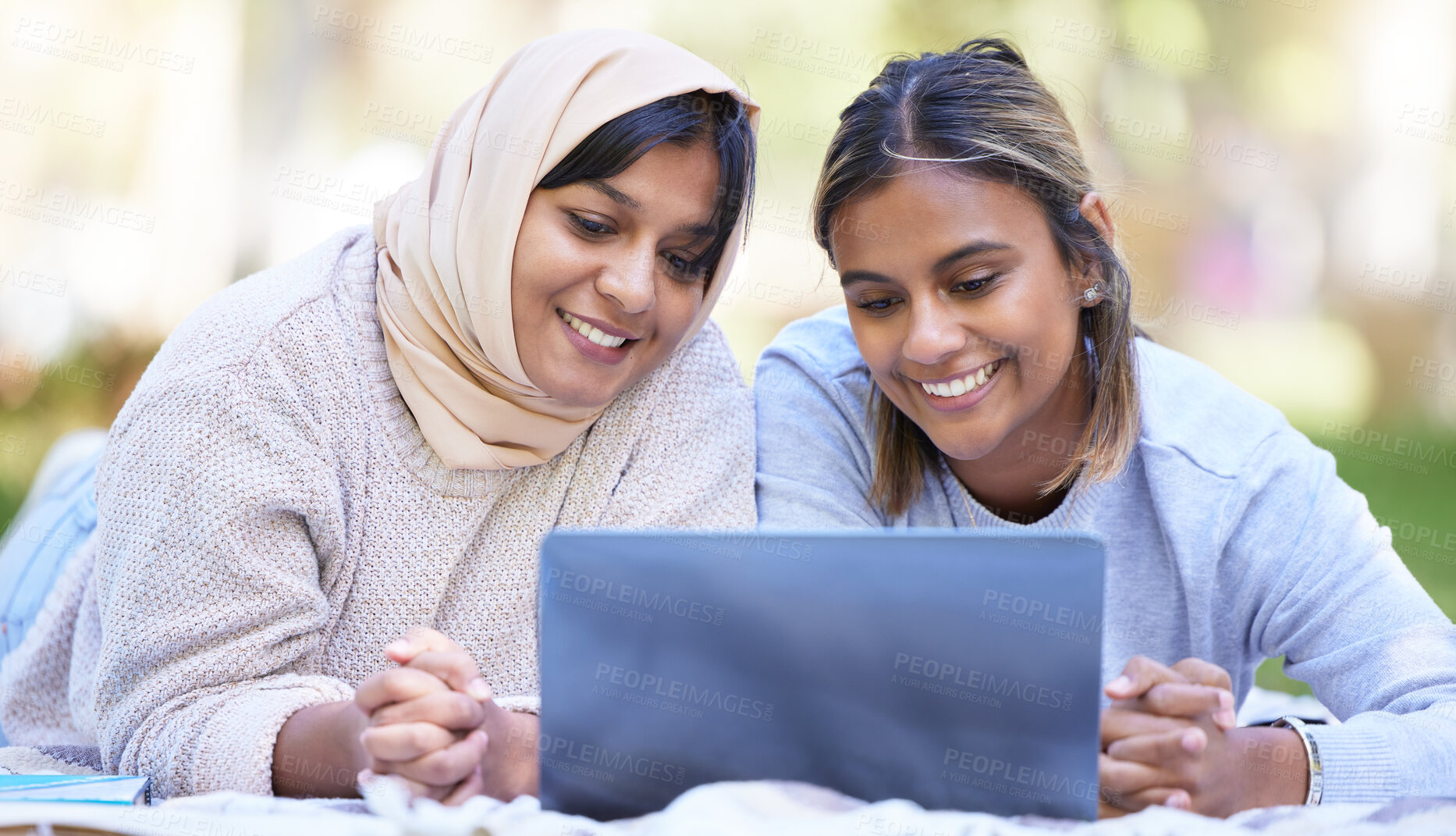 Buy stock photo Muslim women, students or laptop for distance learning, education or research in park, garden or college campus. Smile, happy or Islamic university friends on streaming technology or studying bonding
