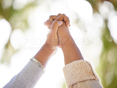 Buy stock photo Hand, support or trust with people outdoor together on a nature green background with lens flare in summer. Friends, hope and motivation with women holding hands in unity or solidarity outside